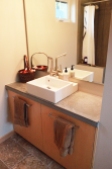Bathrooms are simple and elegant, with concrete countertop made on site.
