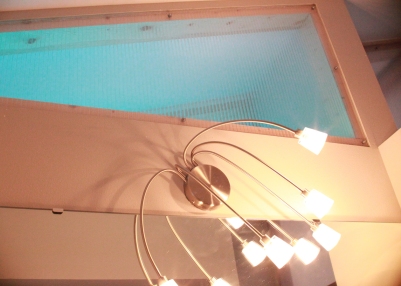 Translucent panels above the bathroom and pantry have glowing LED light strips, which allow for changing colors.